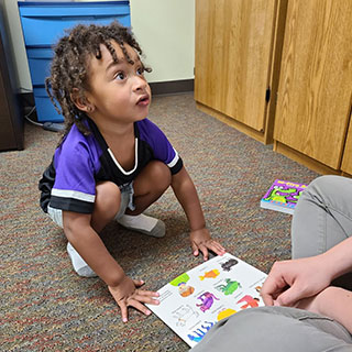 Boy with Book - speech therapy
